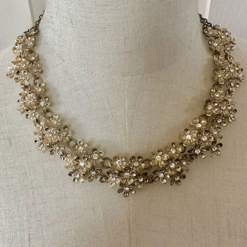 Gold tone flower rhinestone necklace